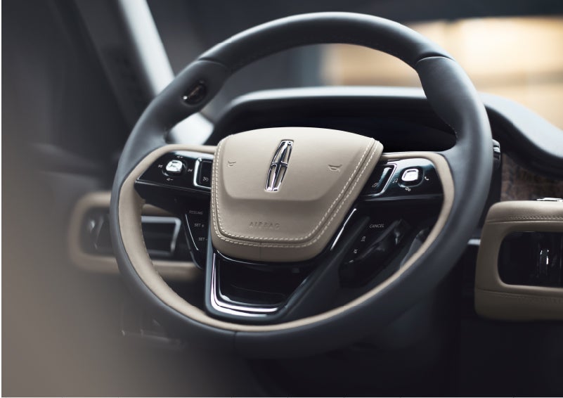 The intuitively placed controls of the steering wheel on a 2023 Lincoln Aviator® SUV | South Bay Lincoln in Hawthorne CA