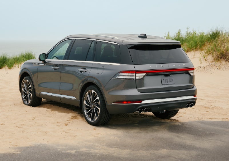 A 2027 Lincoln Aviator® SUV is parked next to sand dunes. | South Bay Lincoln in Hawthorne CA