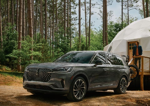 A 2027 Lincoln Aviator® is parked next to a high end glamping site. | South Bay Lincoln in Hawthorne CA