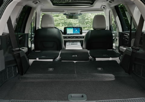A rear to front view of the interior of a 2027 Lincoln Aviator® Black Label™ SUV shows the third and second rows folded flat | South Bay Lincoln in Hawthorne CA