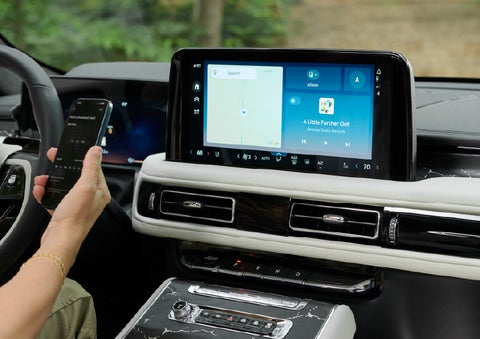 A person pairs thier phone with the center touchscreen of a 2027 Lincoln Aviator® Black Label™ SUV | South Bay Lincoln in Hawthorne CA