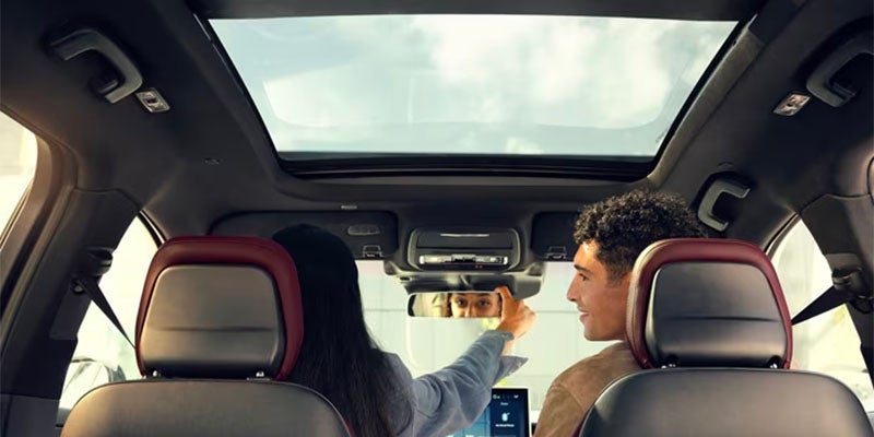 A girl and boy traveling together in 2025 Lincoln Corsair.