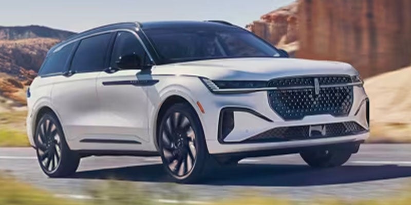 A 2024 Lincoln Nautilus moving along a highway.